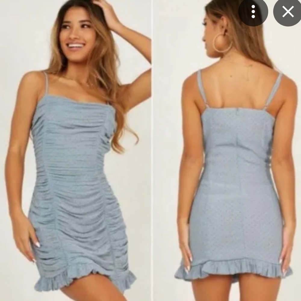 Storia mini dress. Ruched blue with polka dot details. Very flattering.